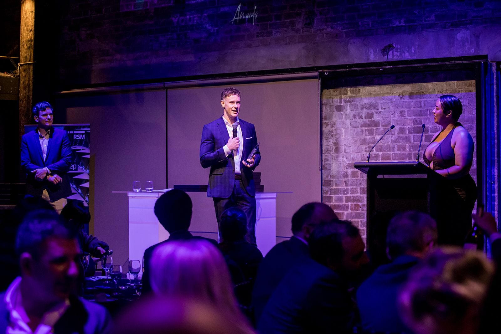 2025 Sydney Young Entrepreneur Awards Gala Dinner Winners accepting trophies on stage at the 2025 Sydney Young Entrepreneur Awards
